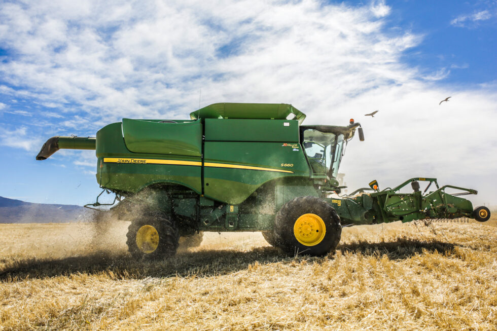 Photo of tractor plowing farm field